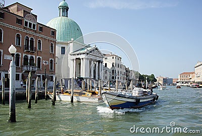 Water taxiâ€™s and boats moving in the water way near the Venic Editorial Stock Photo